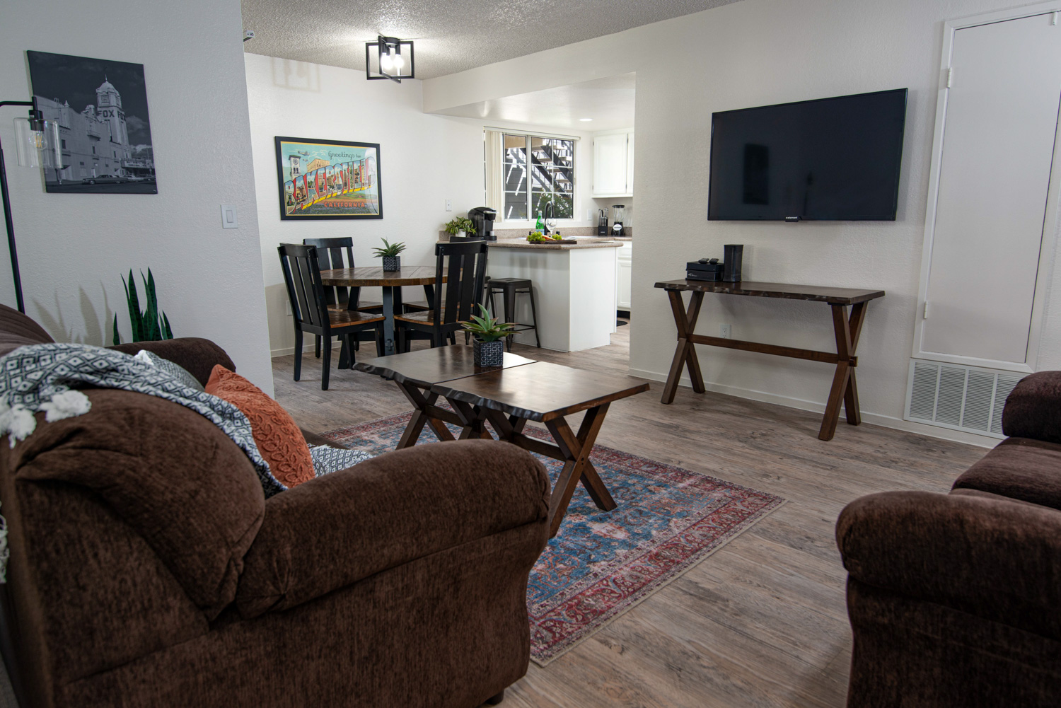 An after photo of an apartment interior featuring true and perfect colors. The image highlights uniform lighting and clear views through the windows, showcasing an ideal living space.