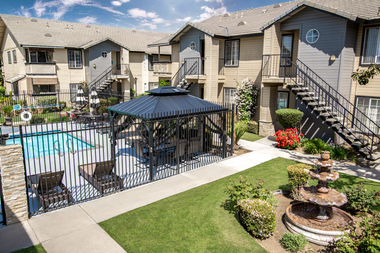 Here’s an after photograph of the same apartment community now under a dramatic sky. We also enhanced the colors and details. The image now displays well-maintained and lush green grass and a crystal-clear pool. We transformed a great photo into an artistic scene. Now, we want to live here.